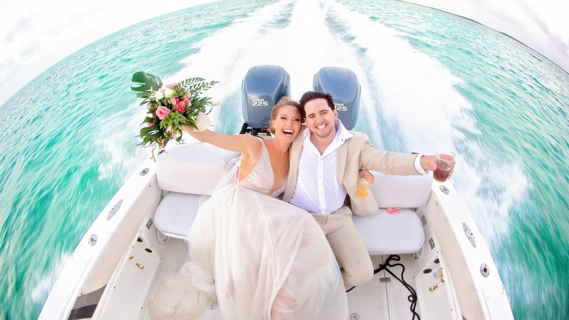 Happy couple in boat at Mahogany Bay Resort & Beach Club